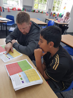 Mr Barrie, Character Building Leader, working with a student